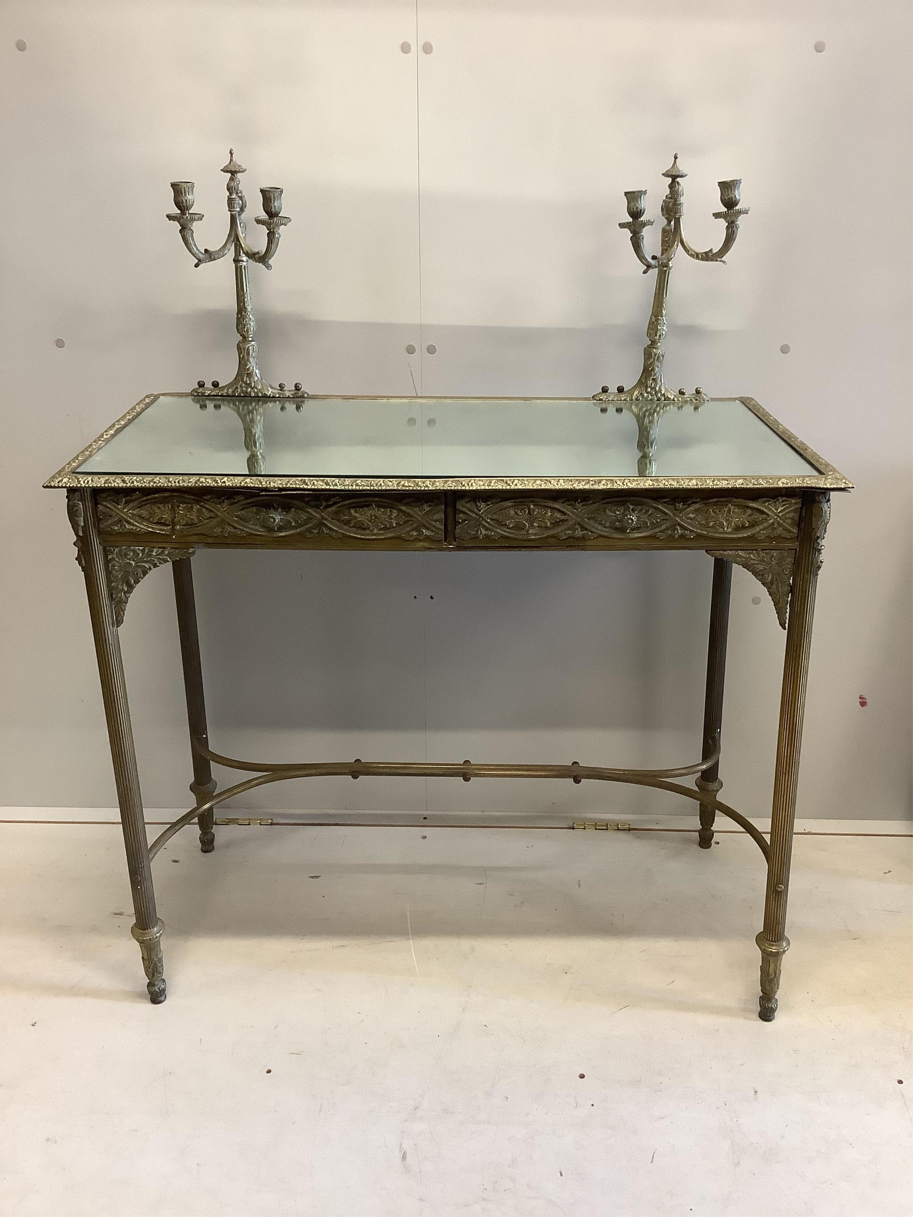 A brass and mirrored console table, width 96cm, depth 48cm, height 118cm. Condition - fair